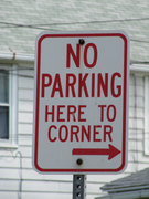No Parking Here to Corner ---->